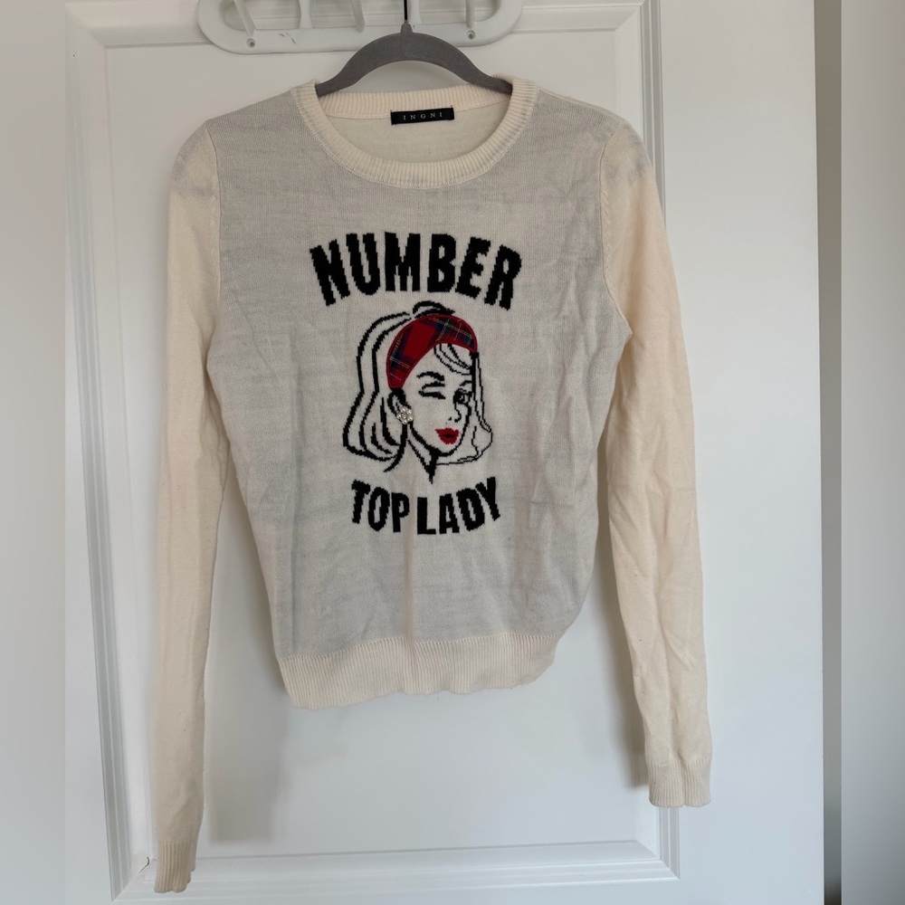 Cream Sweater with Graphic Design and Red Accents